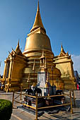 Bangkok Grand Palace,  Phra Si Rattana Chedi of the Wat Phra Keow (temple of the Emerald Buddha). In the foregronud one of the four monuments dedicated to Chakri kings. 